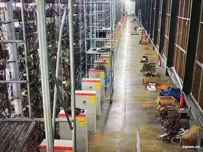 A mining farm filled with rows of mining rigs